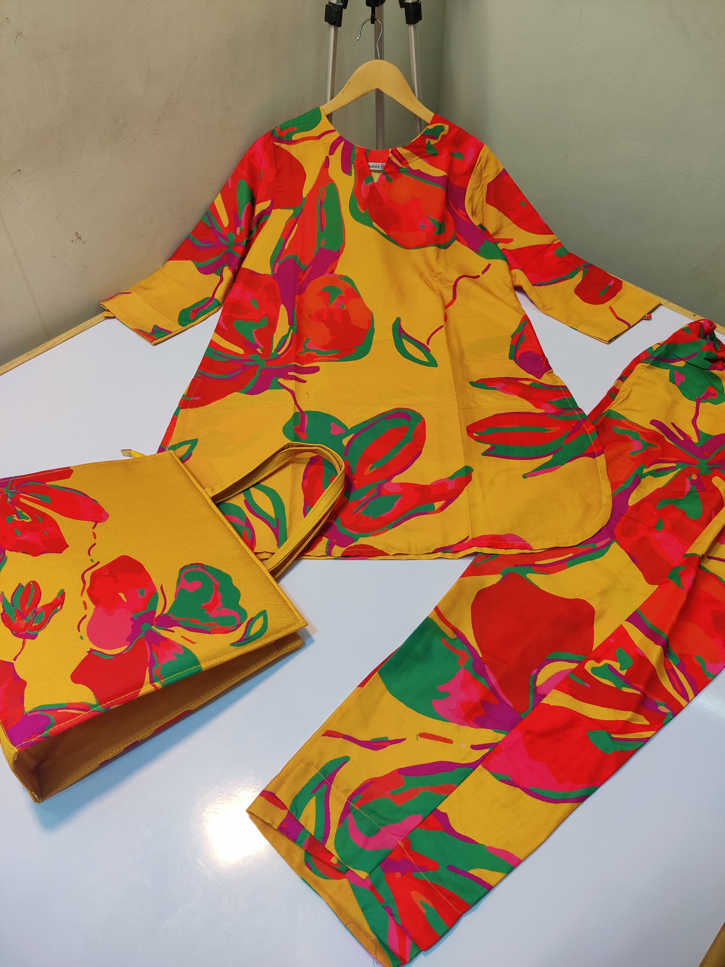 Women swiss fabric suits with same print hand bag